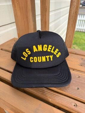 Mighty Fine Black Trucker Hat with Yellow 'Los Angeles County' Text
